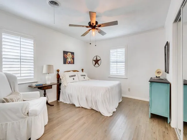 a bathroom with a sink toilet vanity and shower