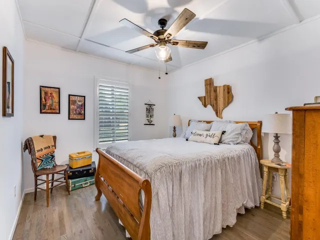 a bathroom with a toilet a sink and shower