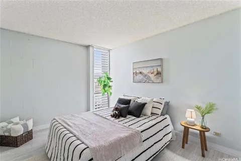a bedroom with a bed and a chair