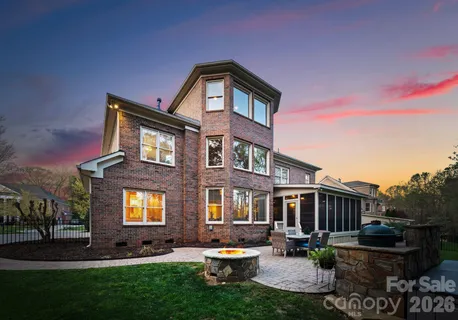 a front view of a house with swimming pool and sitting area