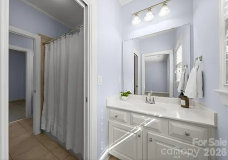 a bathroom with a double vanity sink and a mirror