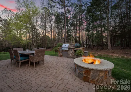 an outdoor space with furniture and garden