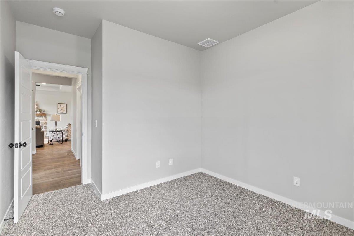 1228 Creekside Way Twin Falls, ID 83301 - Photo 15 of 28 Empty room with carpet and baseboards