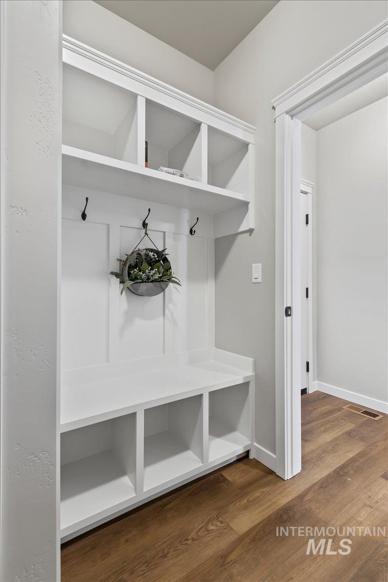 1228 Creekside Way Twin Falls, ID 83301 - Photo 21 of 28 Mudroom featuring dark wood-type flooring and baseboards