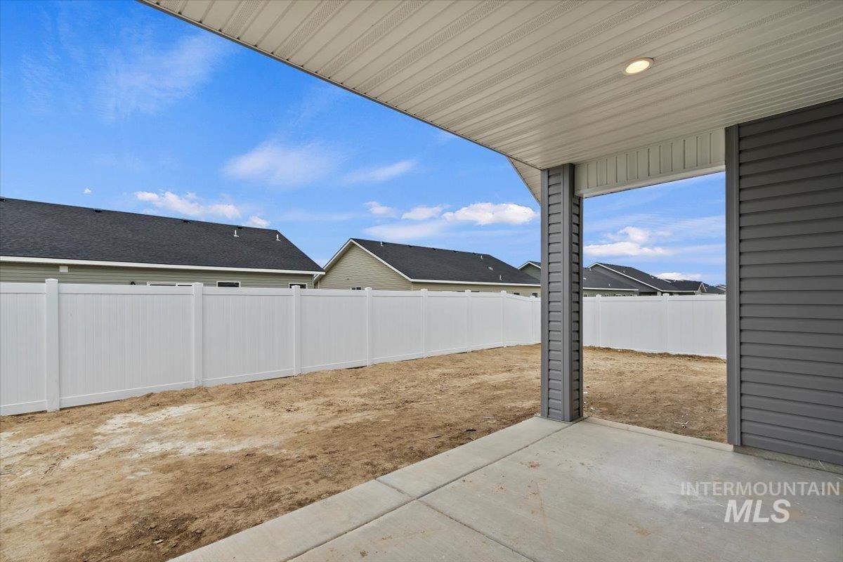 1228 Creekside Way Twin Falls, ID 83301 - Photo 24 of 28 Fenced backyard with a patio and a residential view