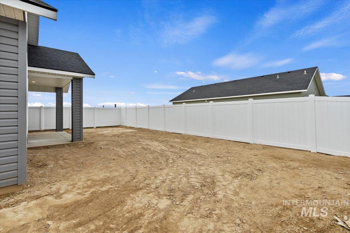 1228 Creekside Way Twin Falls, ID 83301 - Photo 27 of 28 Fenced backyard featuring a patio area