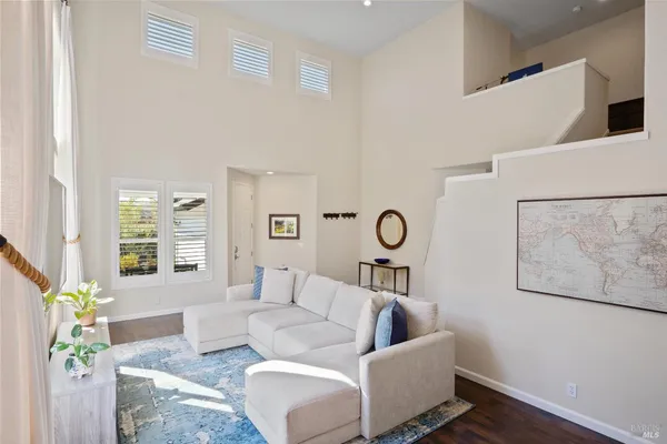 a bedroom with a bed and a flat tv screen on dresser