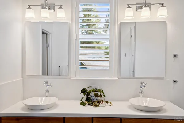 a view of storage and utility room with closet
