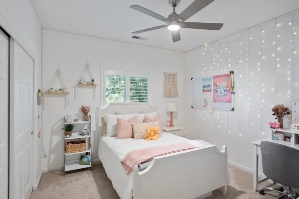 a bedroom with a bed and a couch