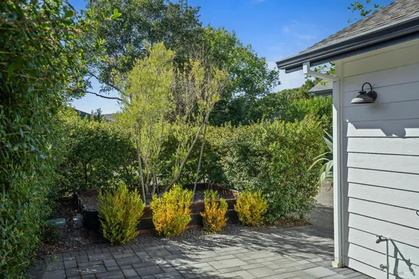 a view of house with yard and a garage
