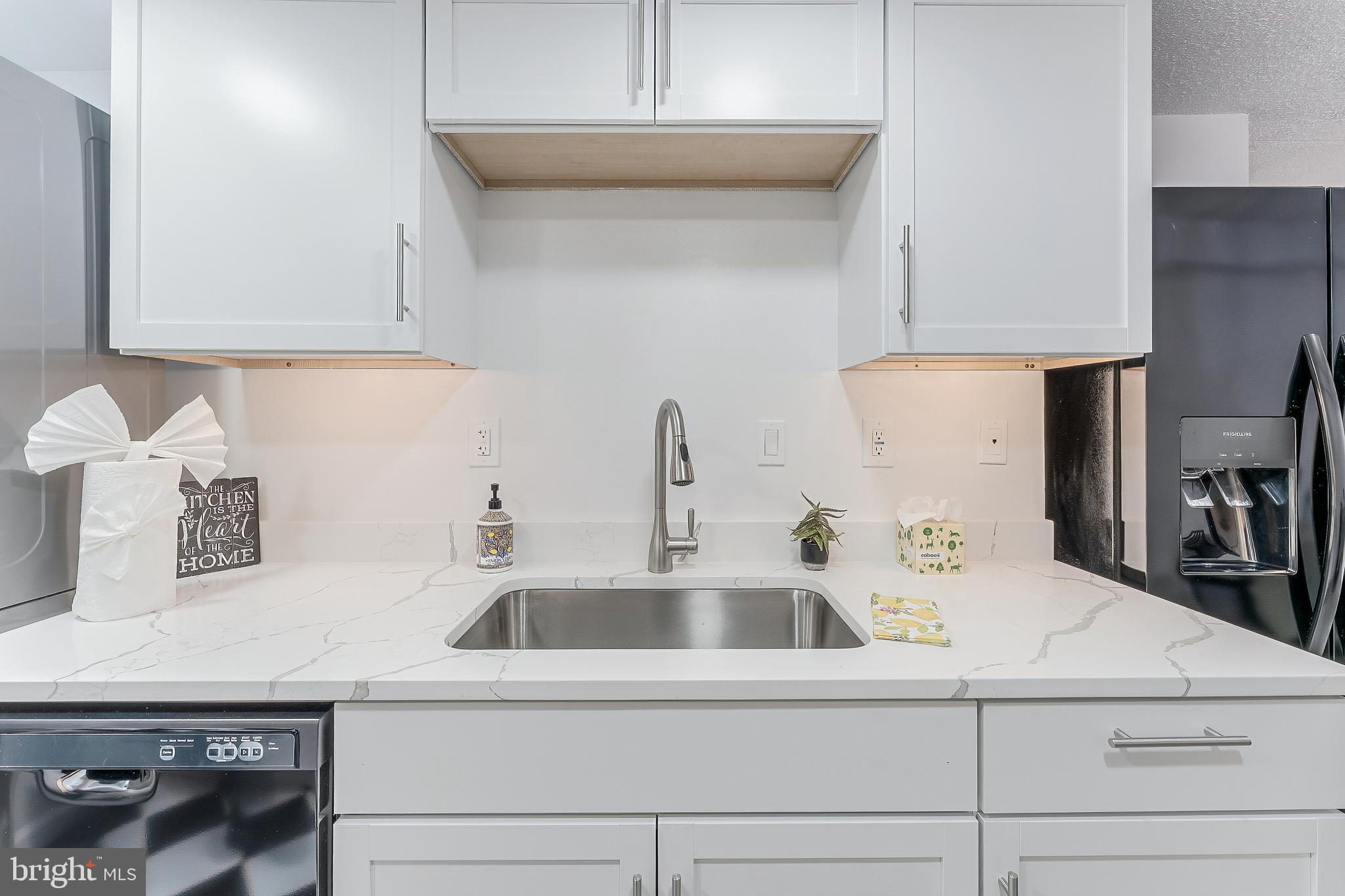 5911 Edsall Road, Unit 708 Alexandria, VA 22304 - Photo 13 of 39 a kitchen with a sink and cabinets