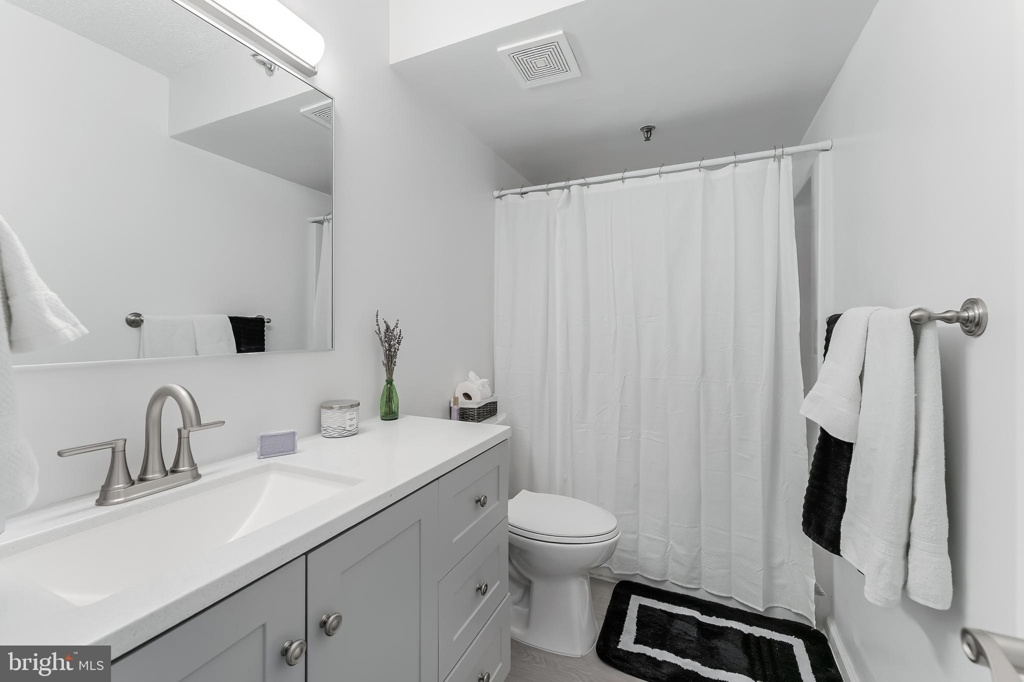 5911 Edsall Road, Unit 708 Alexandria, VA 22304 - Photo 19 of 39 a bathroom with a sink toilet and shower