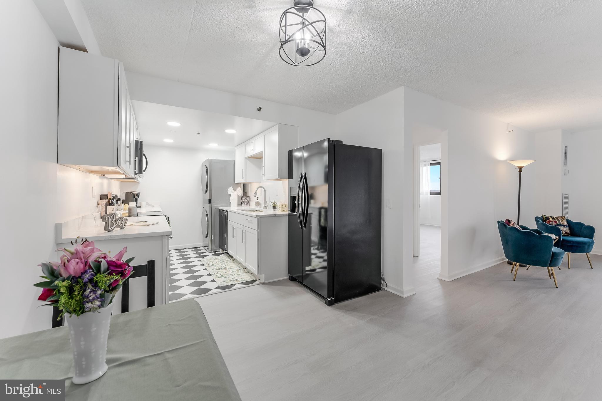 5911 Edsall Road, Unit 708 Alexandria, VA 22304 - Photo 10 of 39 a kitchen with refrigerator and cabinets