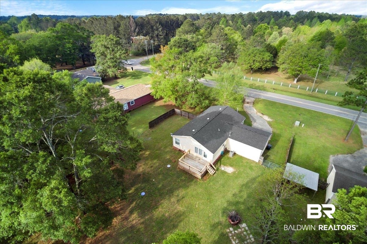6971 March Road Theodore, AL 36582 - Photo 23 of 26 Bird's eye view featuring a forest view