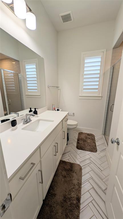 8933 Frostweed Road Frisco, TX 75035 - Photo 21 of 36 a spacious bathroom with a double vanity sink and a mirror