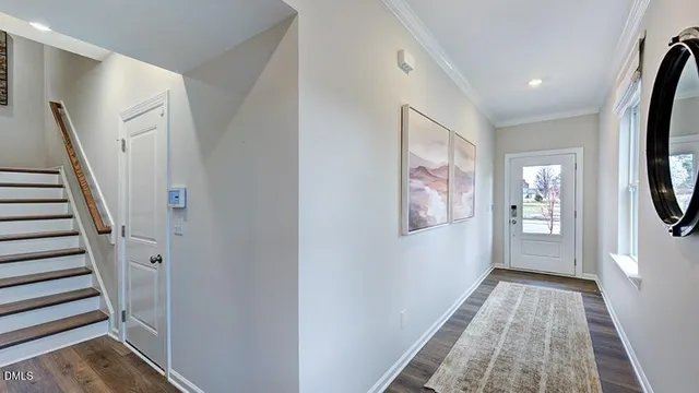 a kitchen with stainless steel appliances a stove a sink a refrigerator and a refrigerator