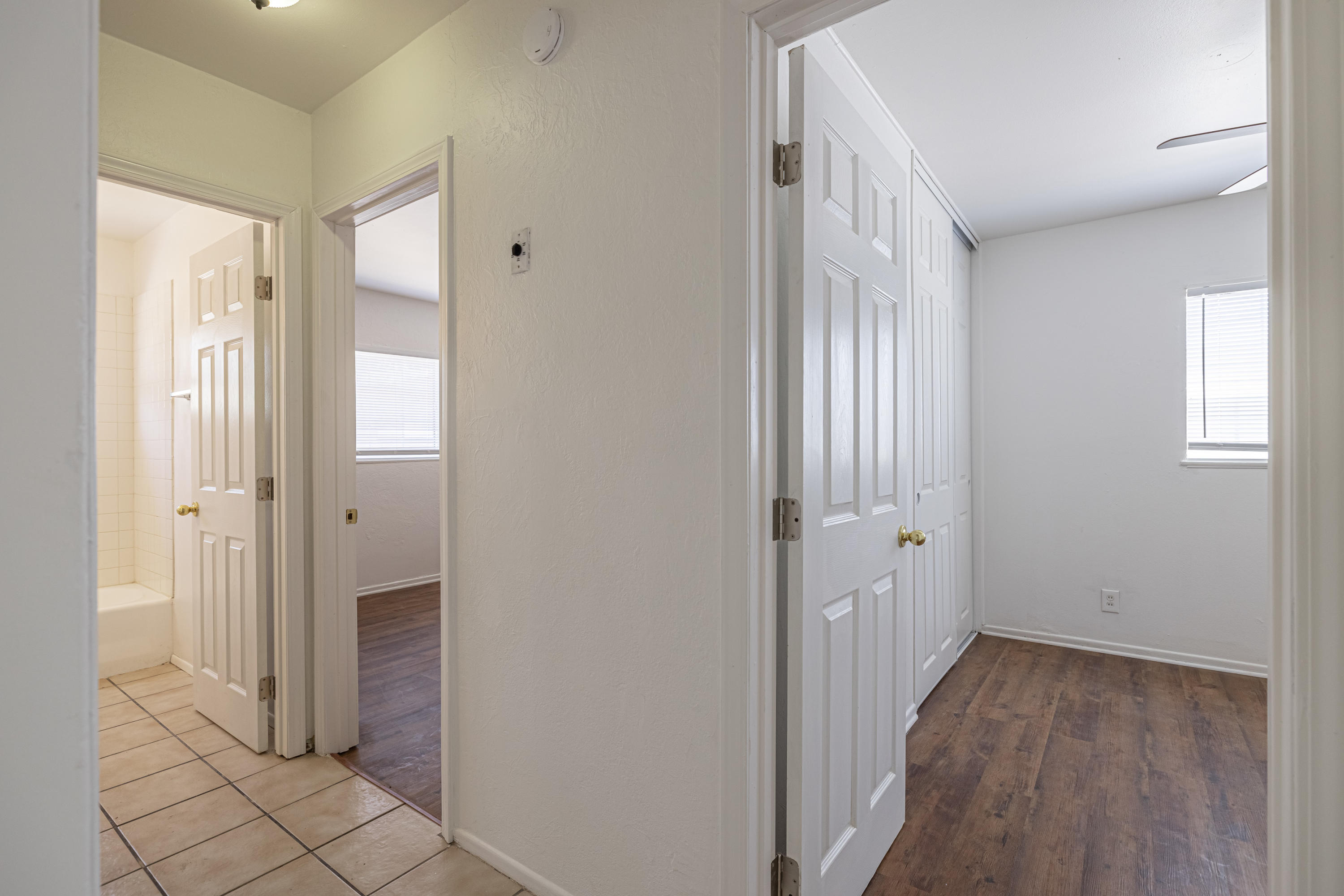 44272 Glenraven Road Lancaster, CA 93535 - Photo 13 of 21 a view of a hallway with wooden floor