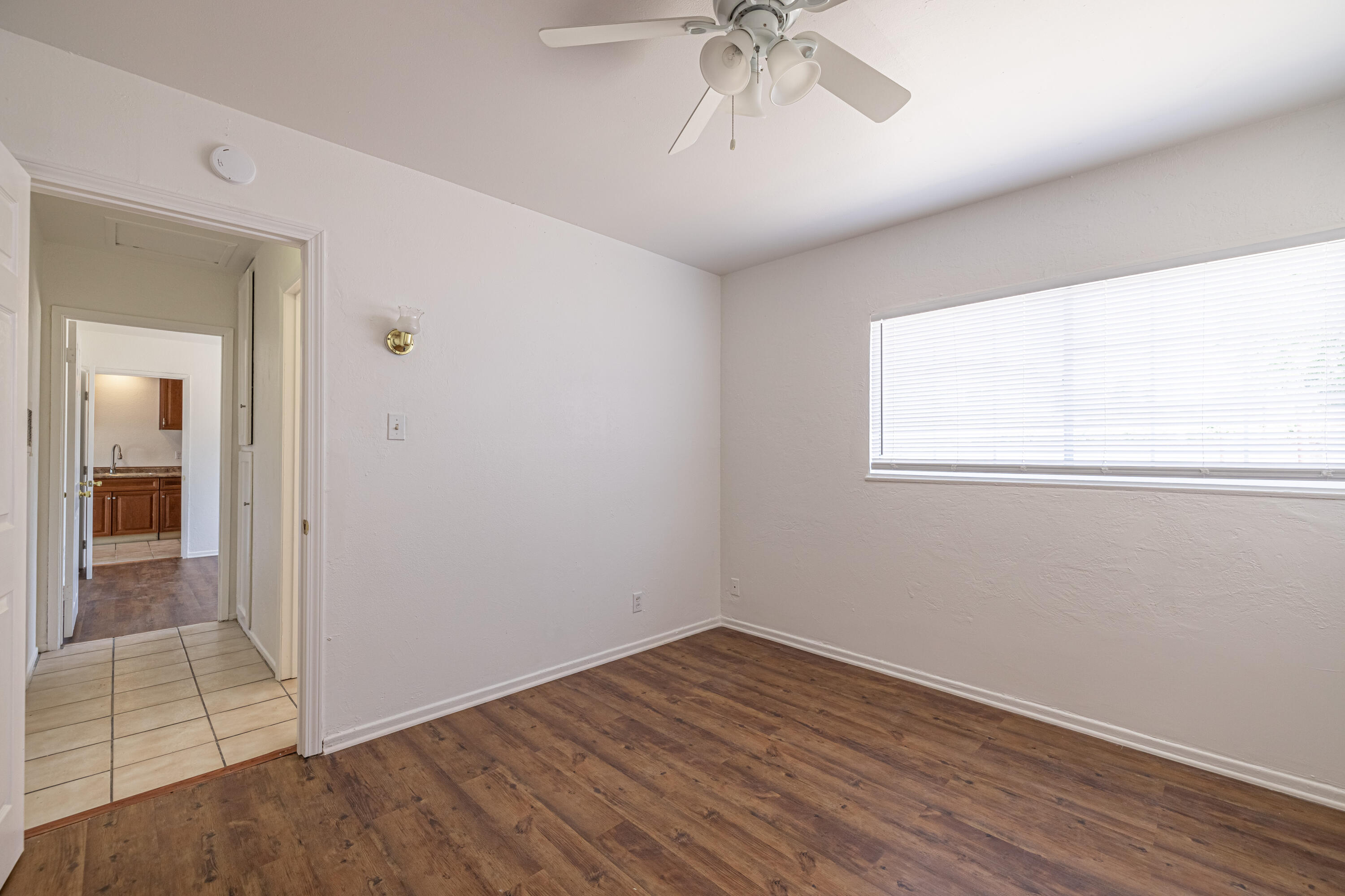 44272 Glenraven Road Lancaster, CA 93535 - Photo 18 of 21 an empty room with a view of a bathroom