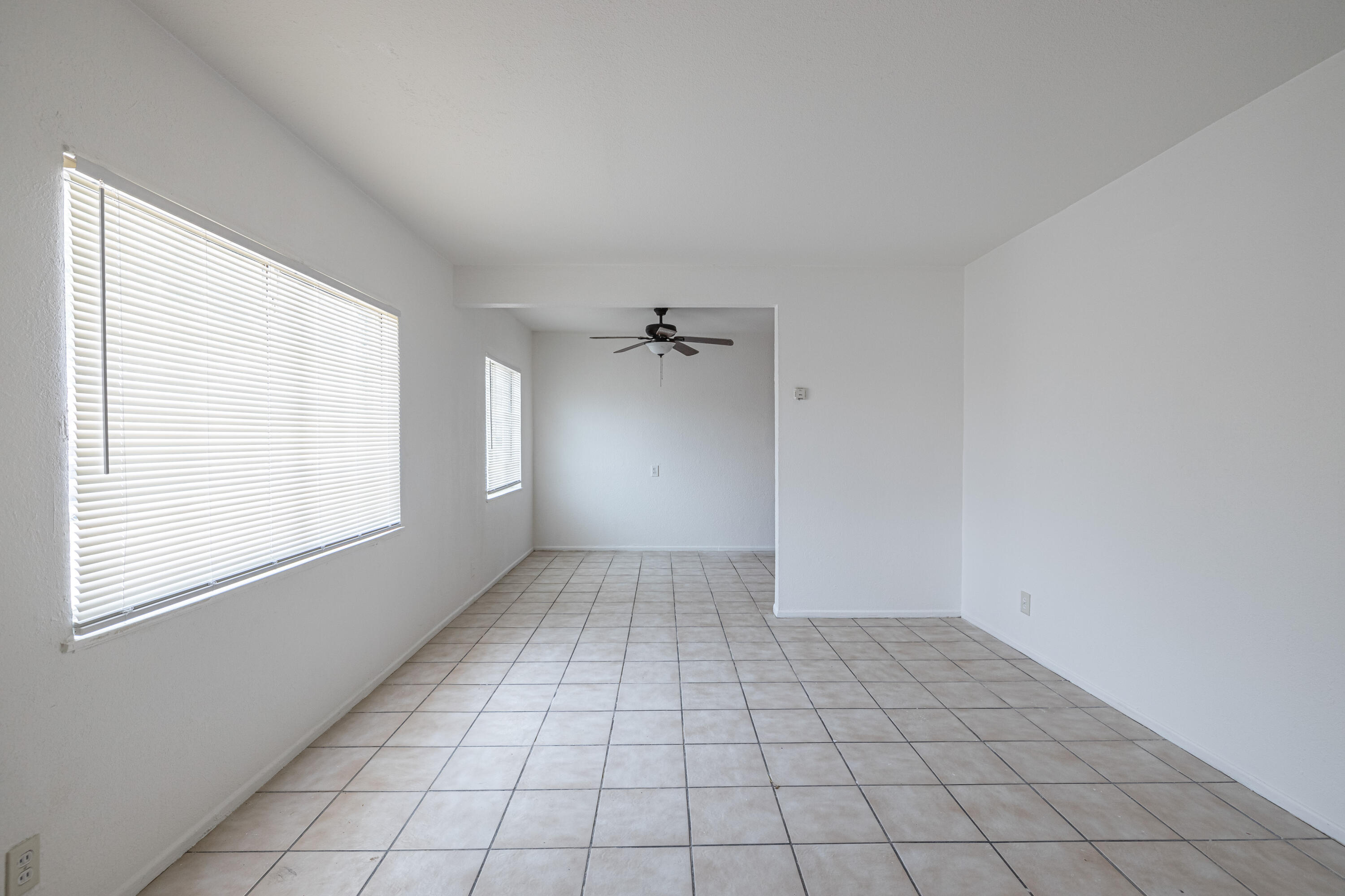 44272 Glenraven Road Lancaster, CA 93535 - Photo 4 of 21 an empty room with windows