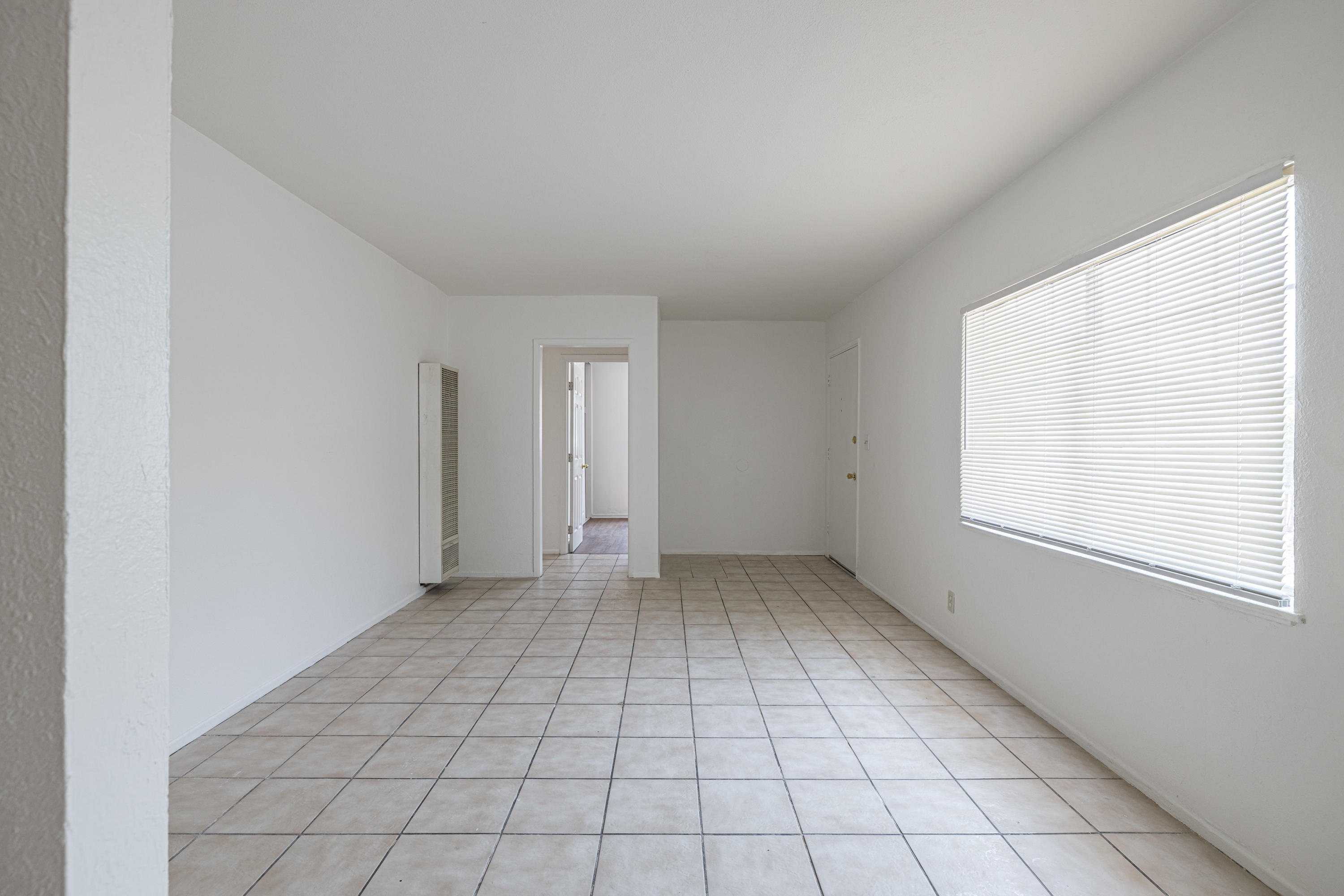 44272 Glenraven Road Lancaster, CA 93535 - Photo 6 of 21 an empty room with windows
