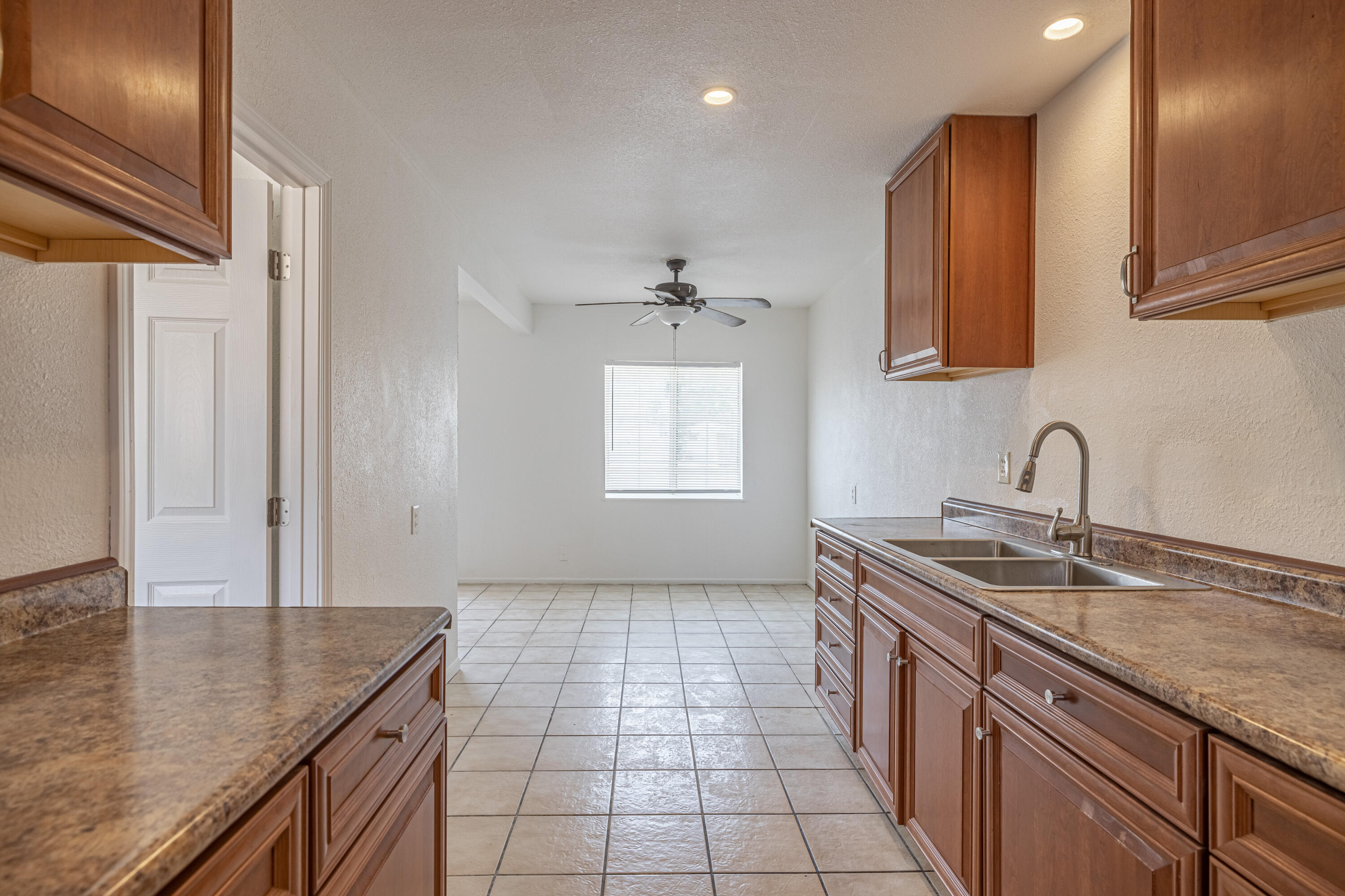 44272 Glenraven Road Lancaster, CA 93535 - Photo 10 of 21 a kitchen with stainless steel appliances granite countertop a sink stove and cabinets