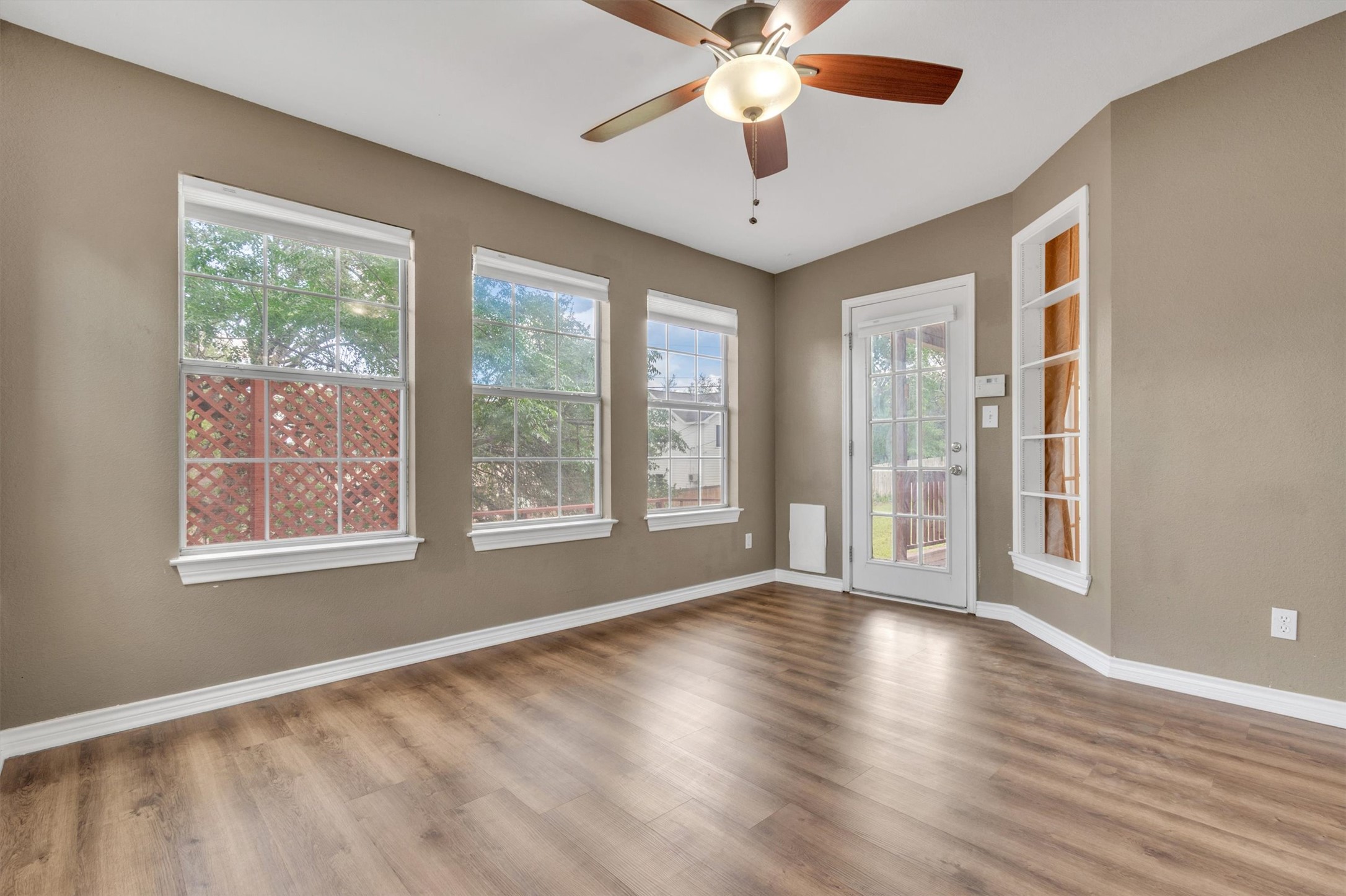 1207 Orlando Road Austin, TX 78733 - Photo 6 of 30 Room featuring wood-finish flooring, neutral wall tones, and white trim