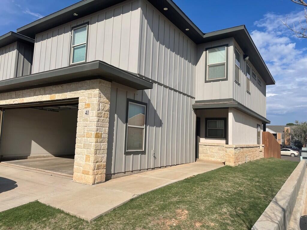 6040 24th Street, Unit 41 Lubbock, TX 79407 - Photo 1 of 12 a house with yard