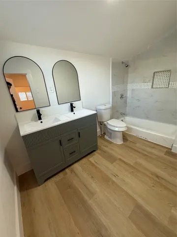 a bathroom with a toilet and a view