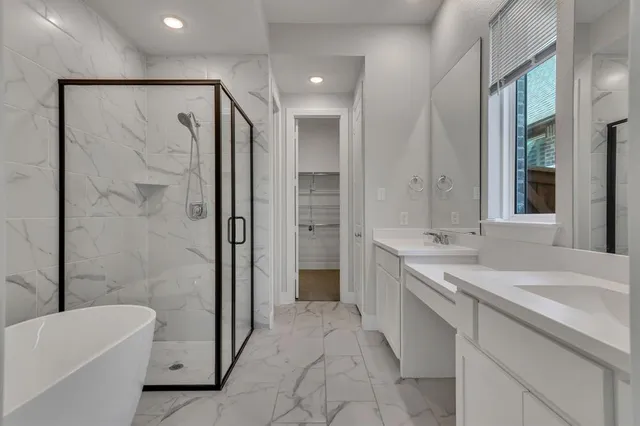 a spacious bathroom with a bathtub shower sink and toilet