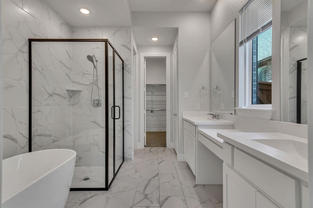 14924 Nightmist Road Aledo, TX 76008 - Photo 12 of 29 a spacious bathroom with a bathtub shower sink and toilet