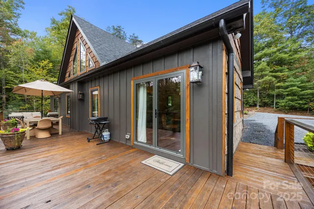 a bedroom with a bed wooden floor and window