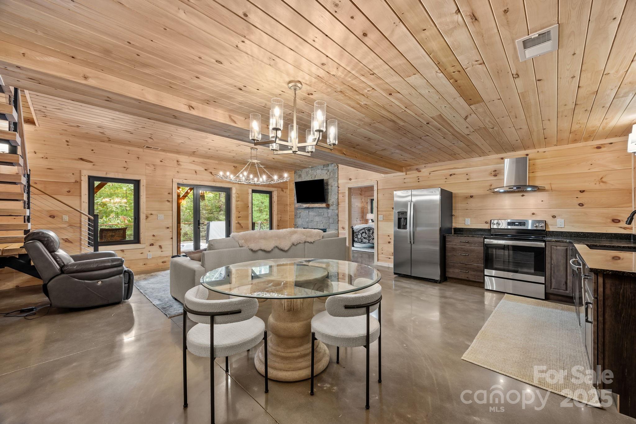 91 Boone Cove Road Zirconia, NC 28790 - Photo 29 of 48 a view of a dining room with furniture window and outside view
