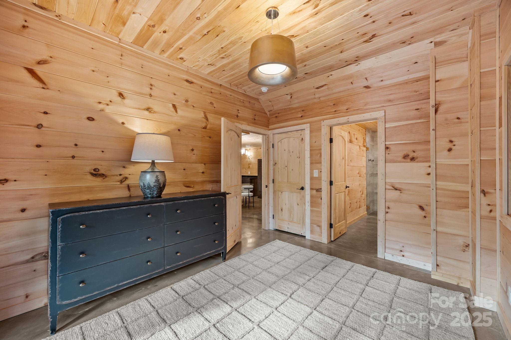 91 Boone Cove Road Zirconia, NC 28790 - Photo 33 of 48 a bathroom with a sink mirror and shower