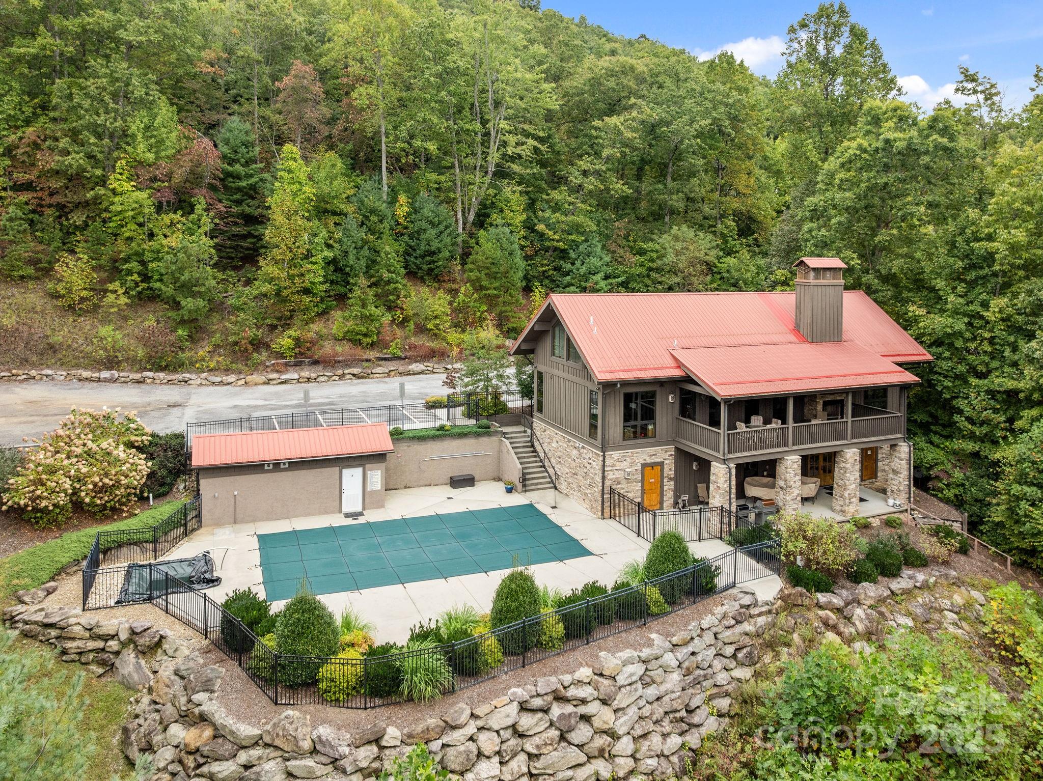 91 Boone Cove Road Zirconia, NC 28790 - Photo 46 of 48 a view of a house with pool and a chairs
