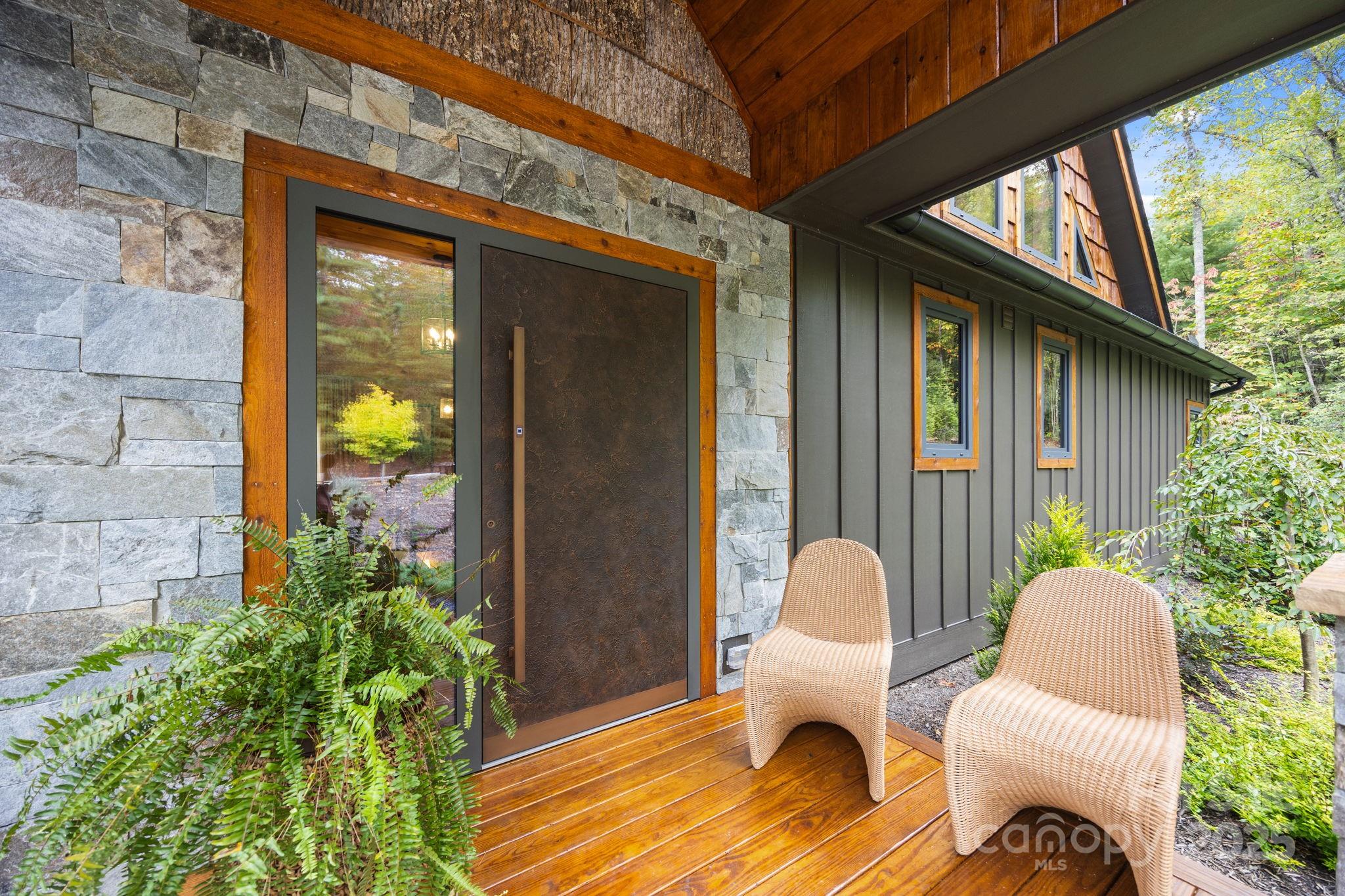 91 Boone Cove Road Zirconia, NC 28790 - Photo 5 of 48 a building outdoor space with patio furniture
