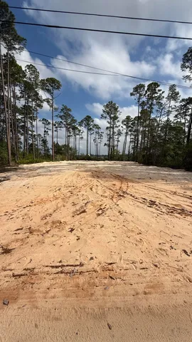 a view of a parking space in front of a building