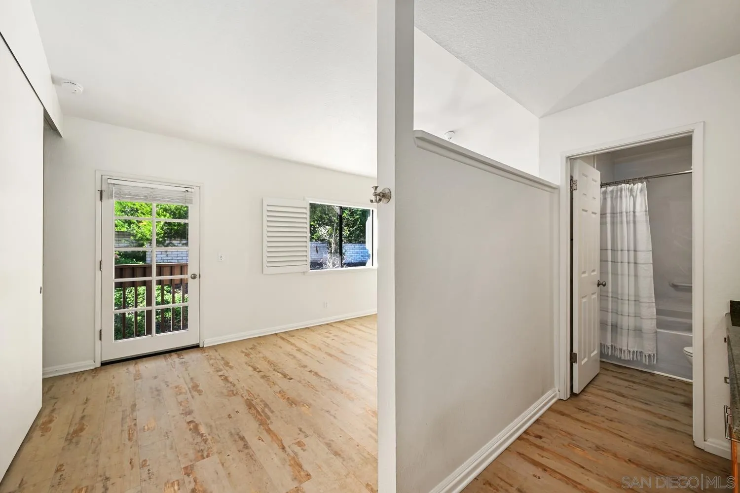 1680 North Coast Highway 101, Unit 30 Encinitas, CA 92024 - Photo 15 of 41 wooden floor in an empty room with a window