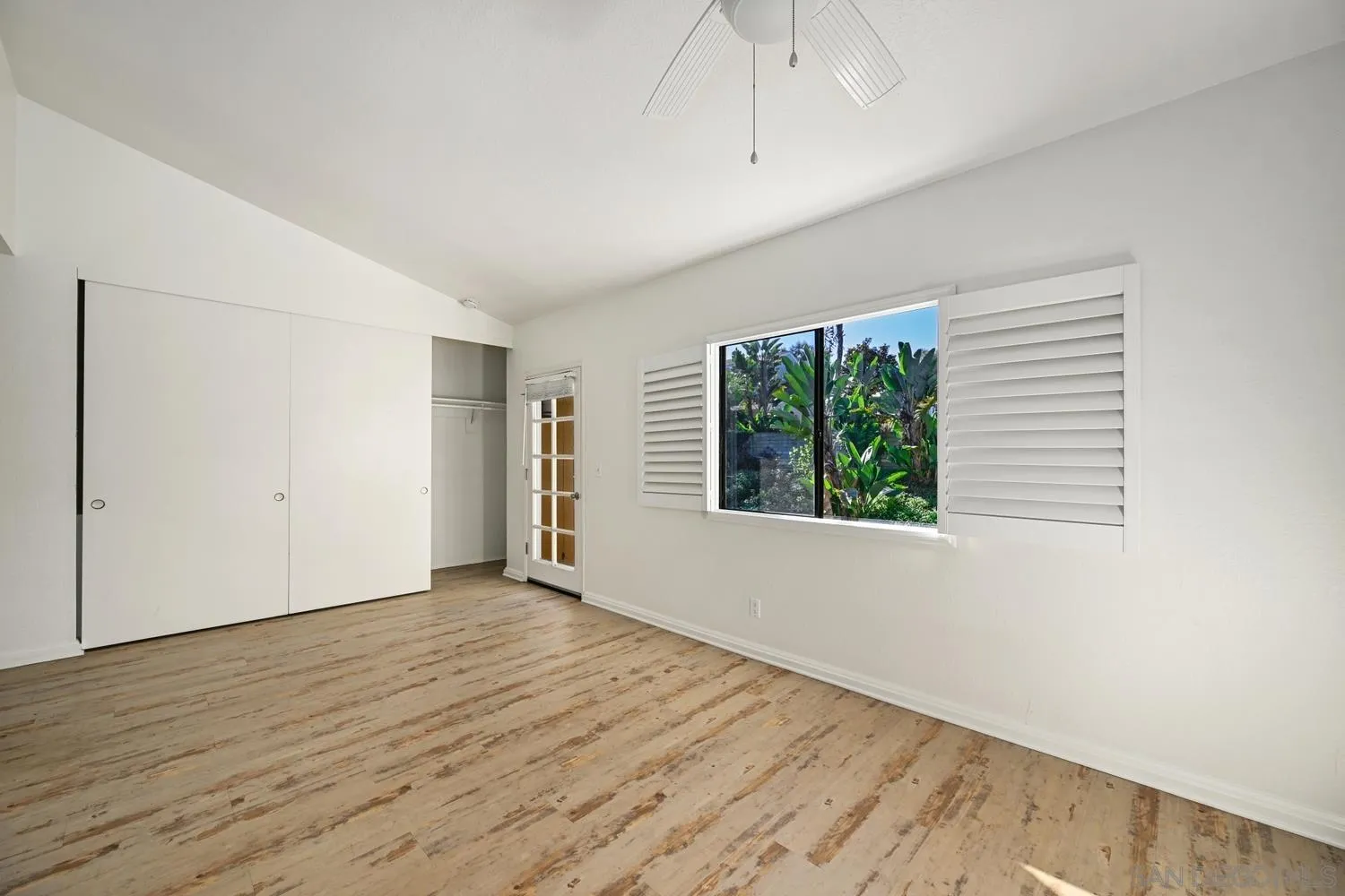 1680 North Coast Highway 101, Unit 30 Encinitas, CA 92024 - Photo 19 of 41 wooden floor in an empty room with a window