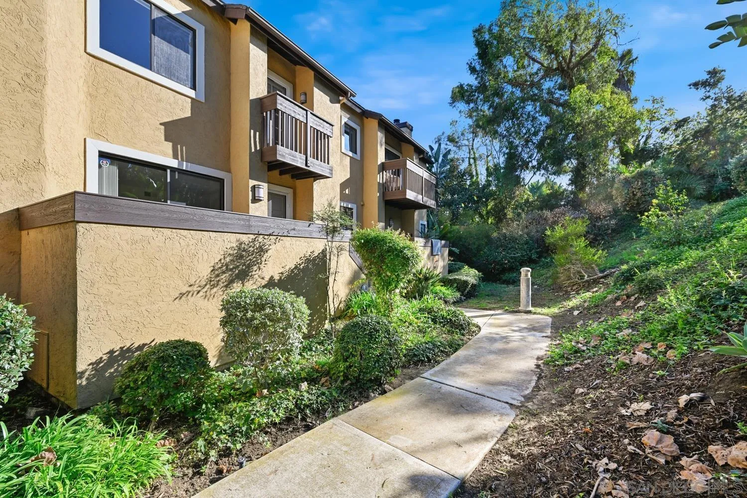 1680 North Coast Highway 101, Unit 30 Encinitas, CA 92024 - Photo 2 of 41 a view of a garden with pathway