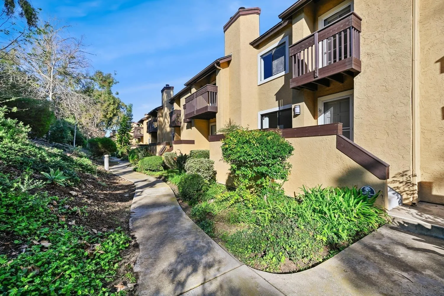 1680 North Coast Highway 101, Unit 30 Encinitas, CA 92024 - Photo 29 of 41 a view of a street with potted plants