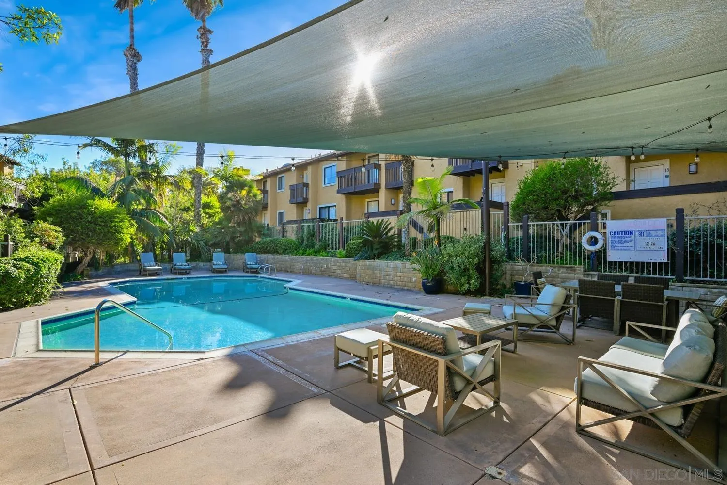 1680 North Coast Highway 101, Unit 30 Encinitas, CA 92024 - Photo 32 of 41 a patio with yard table and chairs