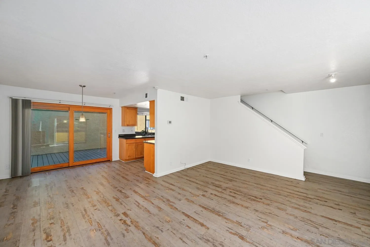 1680 North Coast Highway 101, Unit 30 Encinitas, CA 92024 - Photo 9 of 41 a view of empty room with wooden floor