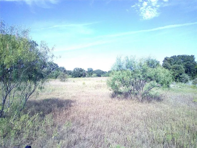 a view of a lake with a big yard