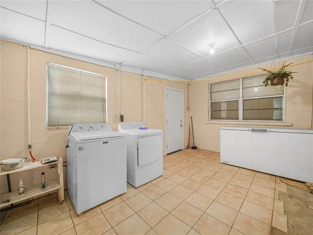 a utility room with dryer and washer
