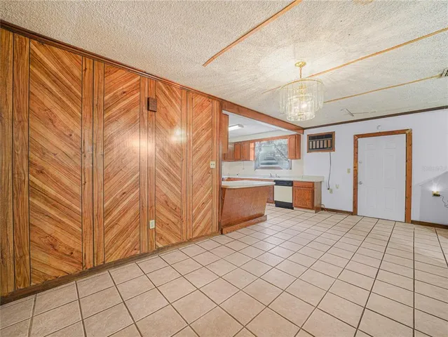 a view of a kitchen with furniture and a window