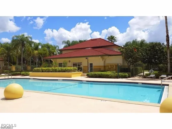 a view of a swimming pool with a patio