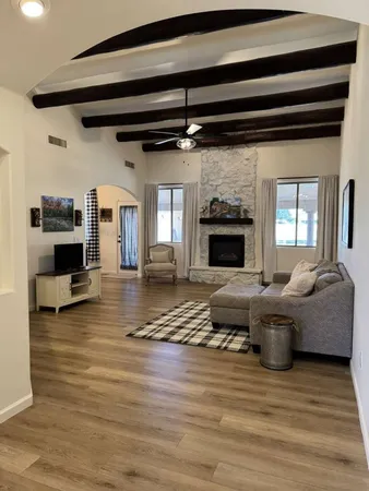 a living room with furniture and a fireplace
