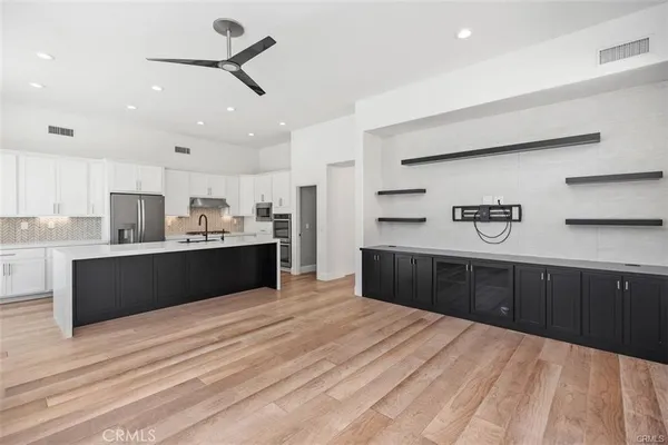 a kitchen with a sink and cabinets