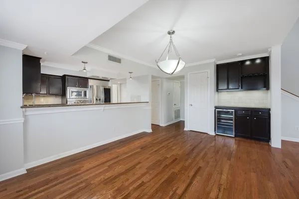 a view of a kitchen with microwave and cabinets