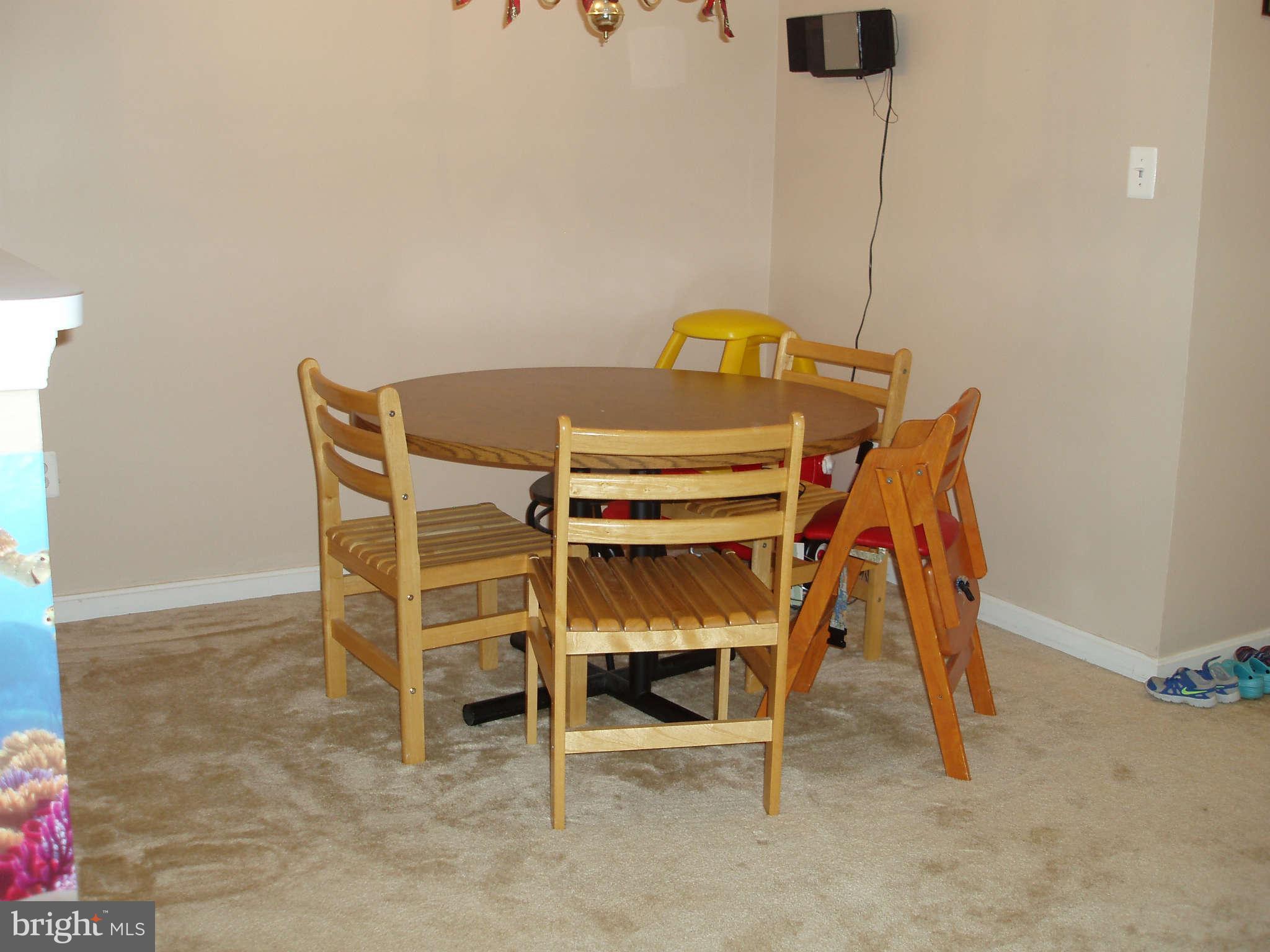 1049 Gardenview Loop, Unit 301 Woodbridge, VA 22191 - Photo 10 of 16 a view of a room with a table and chairs